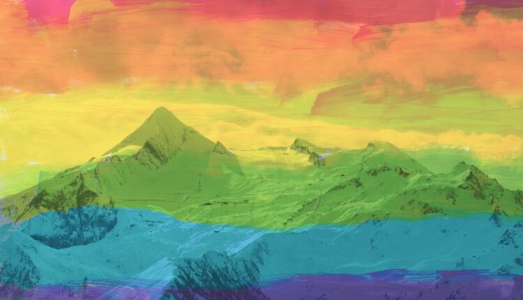 La bandera del Orgullo Gay sobre una foto de la cordillera de os Andes.